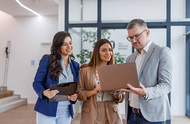 istock Business colleagues collaborating on laptop in modern office 2252483877