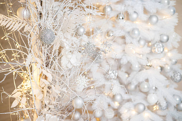 istock A white Christmas tree is decorated with silver plastic toys. Bright festive decoration for the new year 2252484862