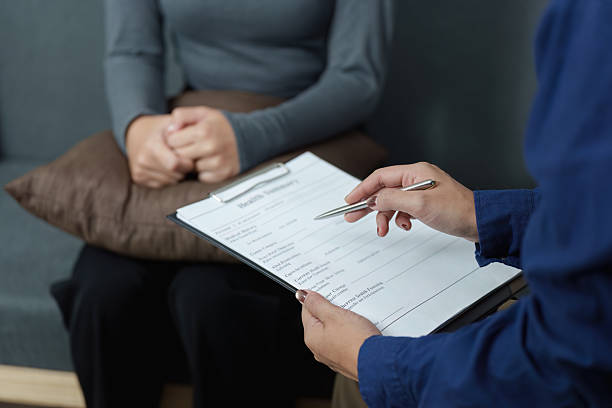 istock Mental Health Consultation. Therapist providing support to a distressed client during a session. 2252485043