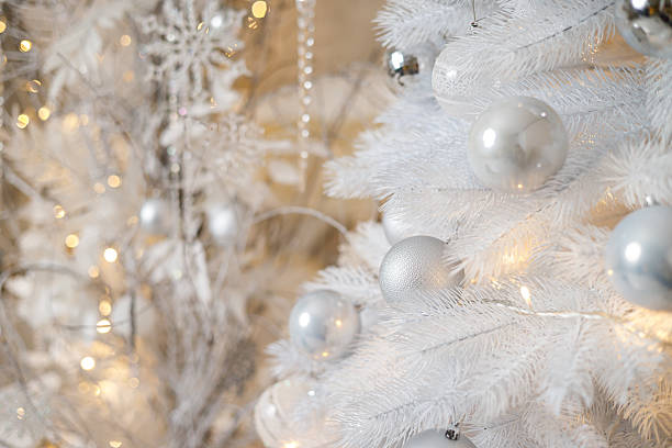 istock A white Christmas tree is decorated with silver plastic toys. Bright festive decoration for the new year 2252485409