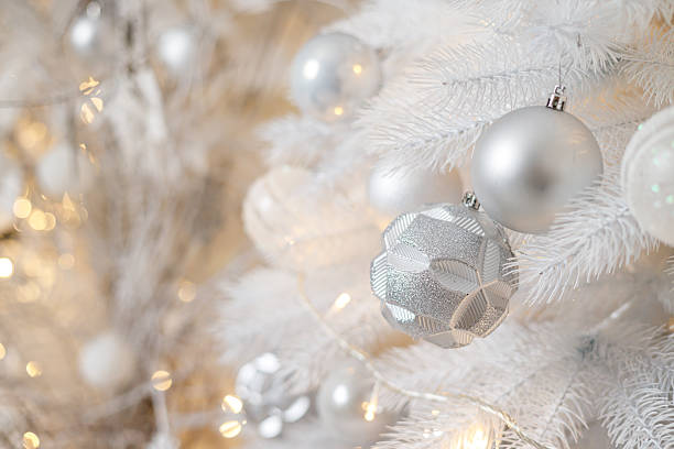 istock A white Christmas tree is decorated with silver plastic toys. Bright festive decoration for the new year 2252485437