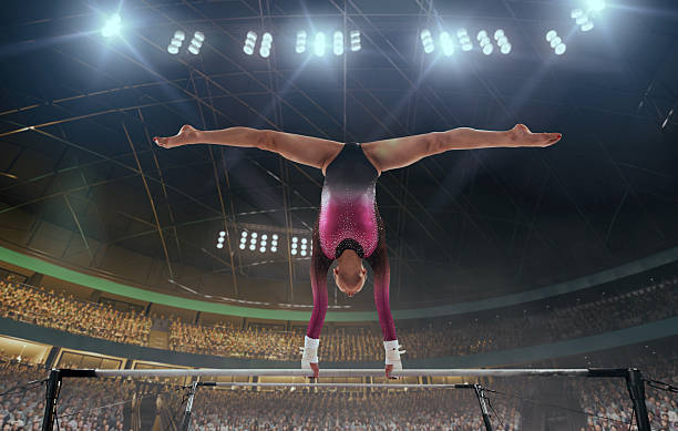 Boy on rings apparatus at gymnastics competition.