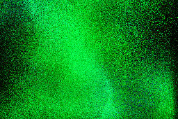 Green black glitter texture abstract banner background with space. Twinkling glow stars effect. Like outer space, night sky, universe. Rusty, rough surface, grain.