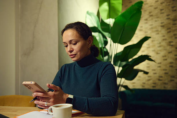 istock Telecommuting Woman In Cafe: Modern Middle Eastern Professional Working Remotely 2252499196