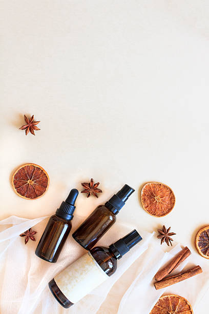 istock Natural cosmetic bottles with essential oils and spices on white background 2252505836