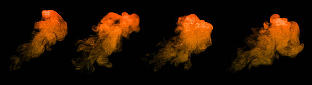 istock Orange and yellow dust particles forming swirling abstract clouds on a black background, creating a vibrant powder explosion effect ideal for artistic design, digital backgrounds, motion graphics. 2252511618