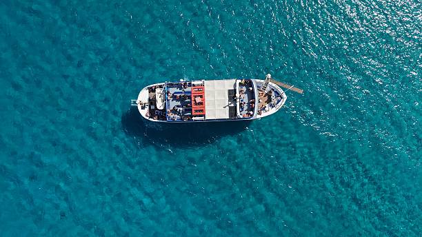 istock Overhead View of a Sunlit Ferry on Crystal Blue Waters 2252512170
