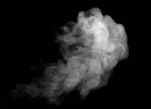 istock Thick white smoke drifting across a black background, creating soft abstract textures and atmospheric motion ideal for design overlays, visual effects, and modern creative concepts. 2252512804
