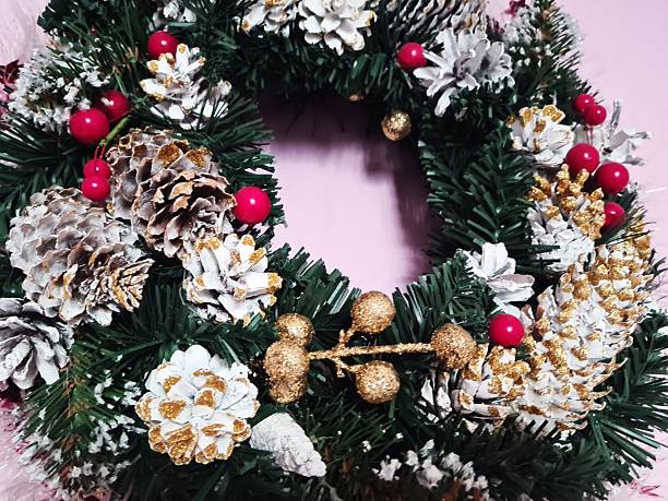 istock Festive Wreath Close-Up: Pine Cones and Red Berries on Evergreen Ring 2252513414