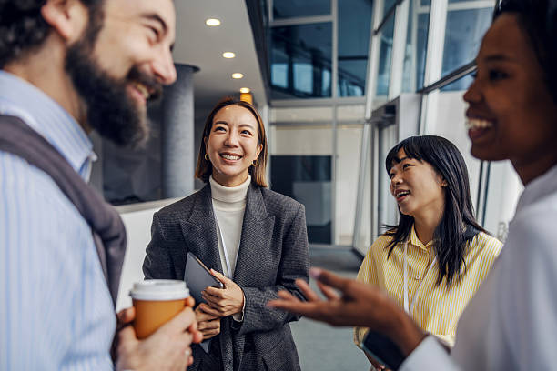 istock Diverse business colleagues networking and discussing in modern office building 2252513691
