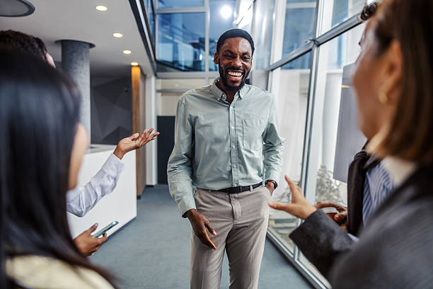 istock Diverse business people laughing during office conversation 2252513726