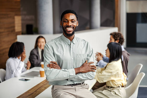 istock Confident black businessman standing in modern corporate office 2252513914