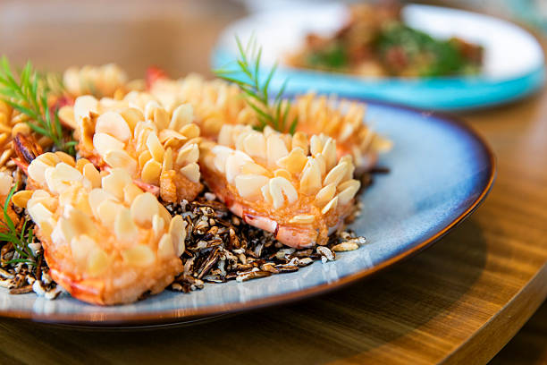 Almond-crusted prawn blossoms on toasted wild rice