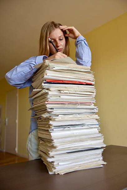 close up on the stacking documents and folders