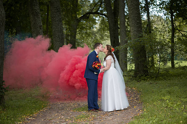 istock Bride And Groom Sharing Quiet Smoke Kiss 2252524518