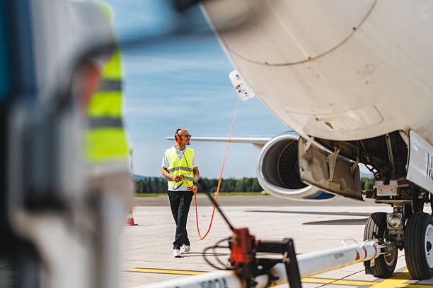 istock Focused Hispanic Technician Conducting Aircraft Tarmac Operations with Precision and Safety 2252524861