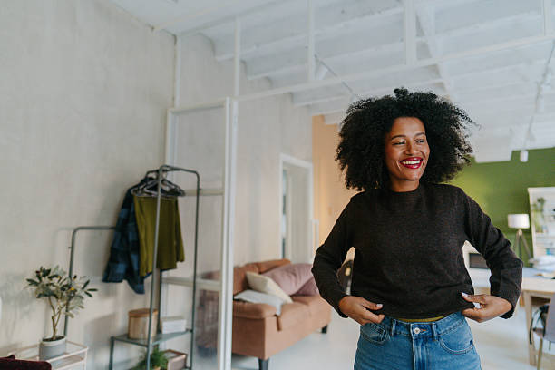 istock Young woman is getting dressed in her home 2252526143