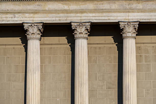 Columns and wall of an old building as an abstract background, architectural details