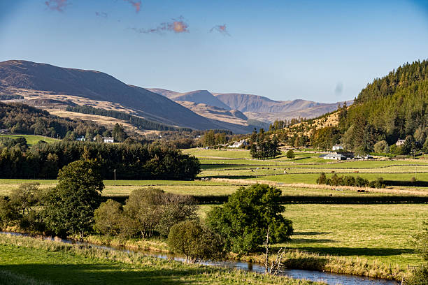 istock Idyllic Glen Isla Countryside Landscape With River, Fields, And Mountain Backdrop 2252526897