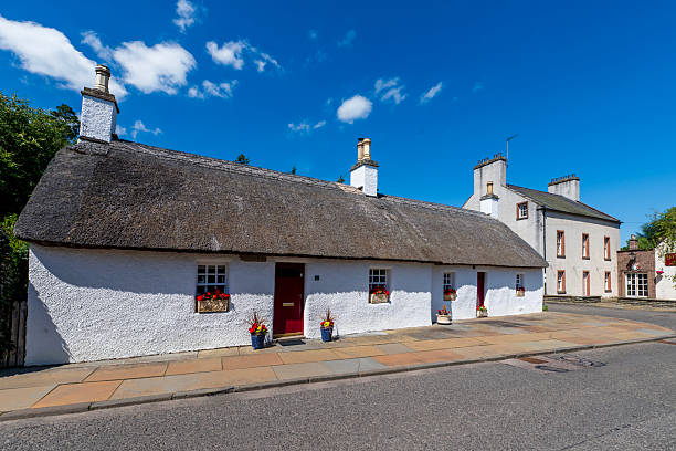 istock Glamis village with Charming White Thatched Cottage Row  m 2252526900
