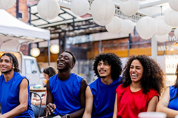 istock Friends cheering while watching a basketball match at the bar 2252526912