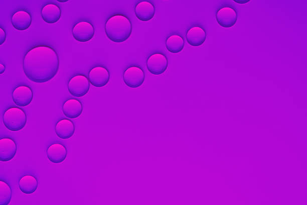 clear water drops or cosmetic serum bubbles on a smooth, reflective magenta and purple surface. This abstract background evokes themes of freshness, purity, hydration, and modern design.