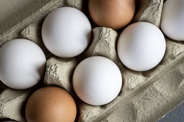 istock Fresh eggs in organic carton box on the farm. 2252527902