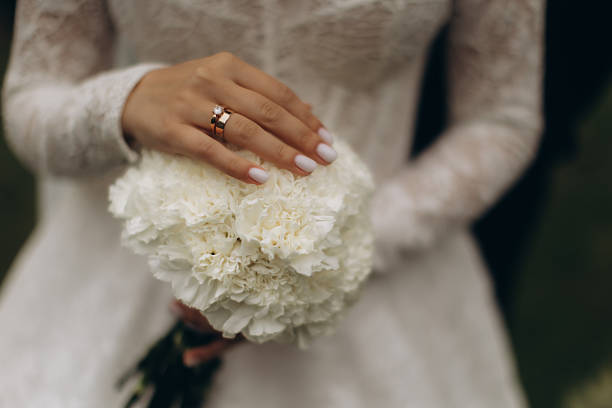 White wedding bouquet in the bride's hand
