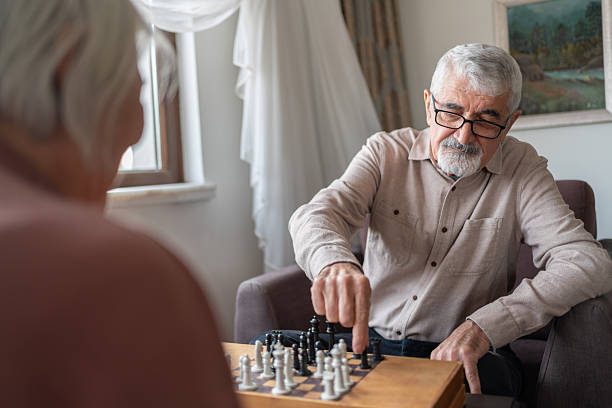istock Senior Couple Playing Chess At Home 2252532125