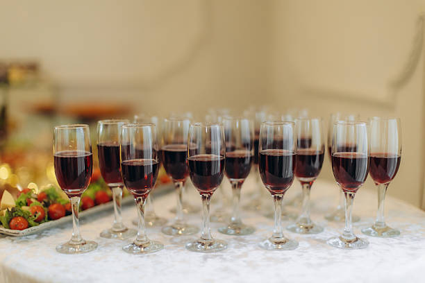 istock Red wine glasses filling celebration event table 2252532293