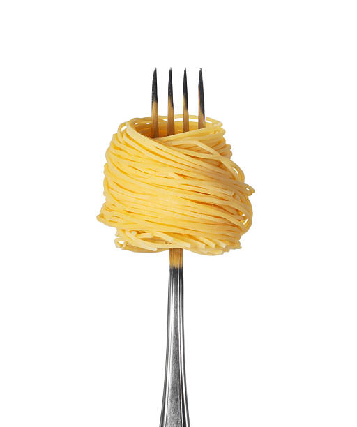 istock Spaghetti wrapped around fork close-up isolated on a white background 2252536340