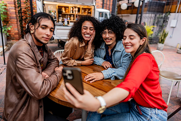 istock Friends taking selfie in coffee shop 2252537125