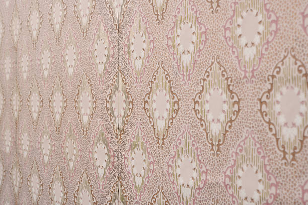 istock Old wallpaper on the wall. Old wallpaper for texture or background. 2252538861