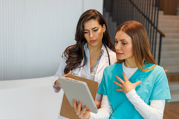 istock Two female healthcare workers review patient data on a tablet device 2252539800