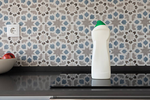 istock All-Purpose surface cleaner bottle mockup on induction cooktop in modern kitchen 2252546384