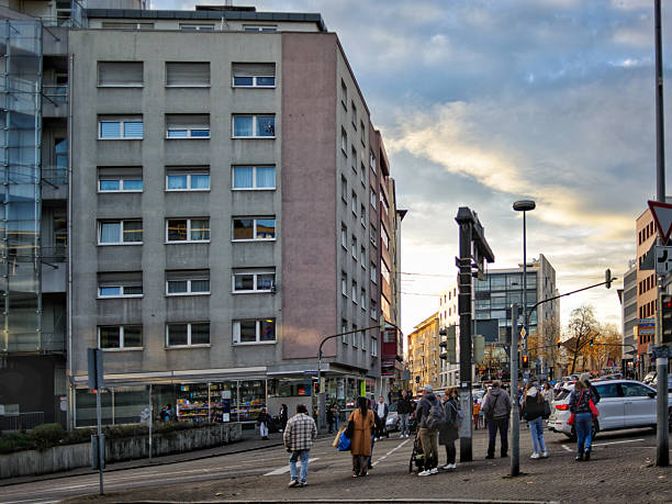 Pforzheim, Germany Dezember urban intersection with waiting commuters, group gathered at crosswalk