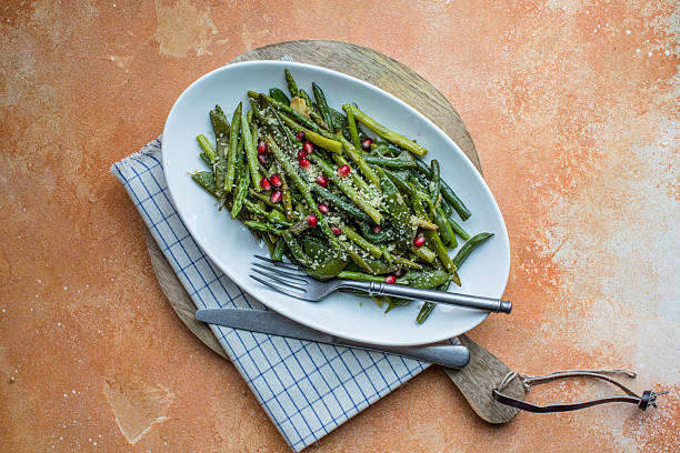istock Fresh asparagus spears topped with grated Parmesan on a rustic plate 2252550573