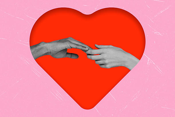 istock Hands reaching out to connect inside a heart shape on a bright pink background showcasing love and togetherness 2252555091