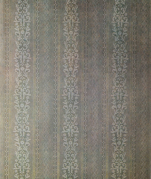 Old wallpaper on the wall. Old wallpaper for texture or background.