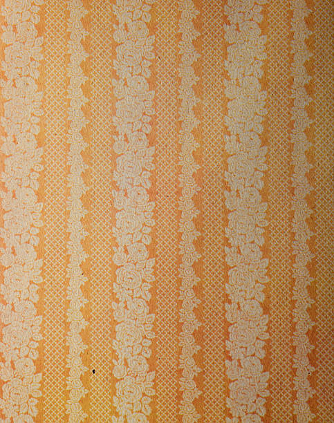 Old wallpaper on the wall. Old wallpaper for texture or background.