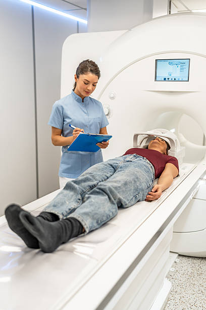 istock Medical professional preparing patient for mri scan 2252557458