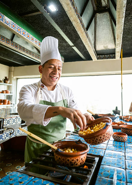 Chef preparing Chiles en Nogada in commercial kitchen