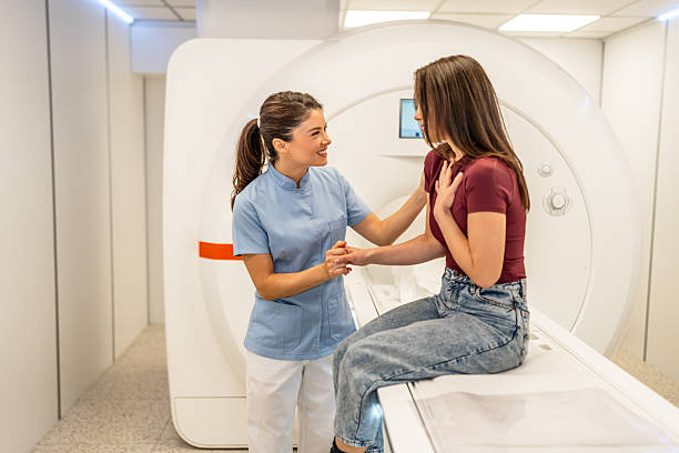 istock Nurse comforting patient before mri scanning procedure 2252557859