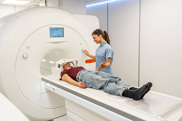 istock Radiographer preparing patient for mri scan 2252557912