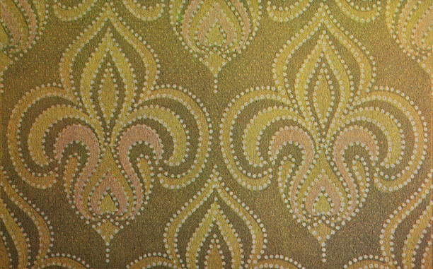 Old wallpaper on the wall. Old wallpaper for texture or background.