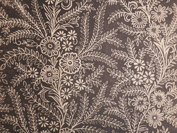 Old wallpaper on the wall. Old wallpaper for texture or background.