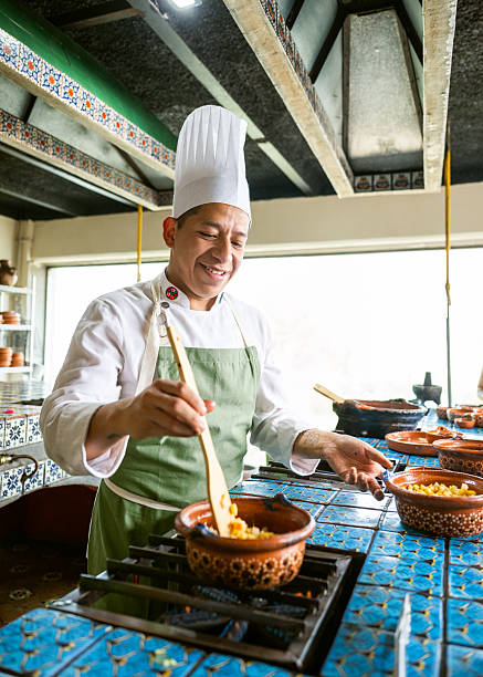 Chef preparing Chiles en Nogada in commercial kitchen