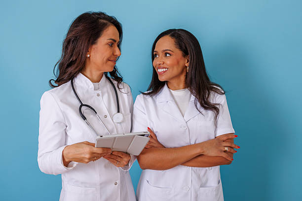 istock Female doctors collaborating, looking at a digital tablet, discussing patient charts and medical information 2252558814
