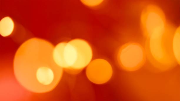istock Yellow blurred lights on red background, abstract bokeh light. Red Christmas background with bokeh, flare light on black background, overlay effect. Valentines Day. 2252560848