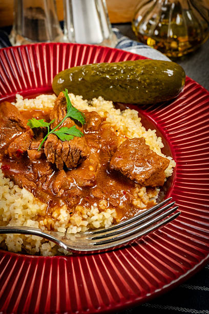 istock Chunky beef stew with savory sauce, served with bulgur groats. 2252561186